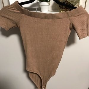 Tan across the shoulder body suit